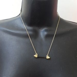 Gold chain with dumbell pendant